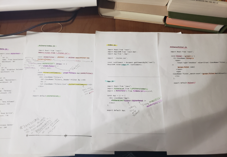 a photo of React code printed out; it has highlights and hand-written notes on it