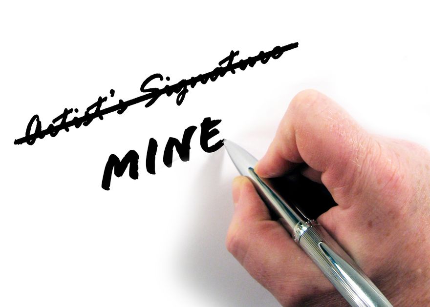 Photograph of a hand holding a pen scratching out "author's signature" and writing "mine" instead