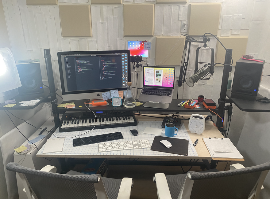 Portrait of the PE desk with many computers, iPad mounted to wall, microphones and speakers for recording video tutorials