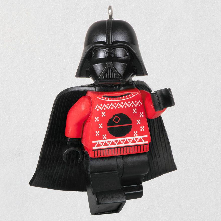 LEGO Darth Vader wearing a red sweater with the Death Star on it.