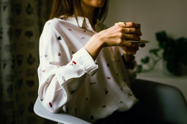 woman holding teacup