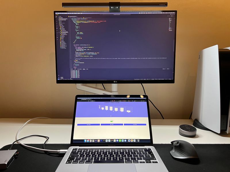 Room with lights on and monitor with BenQ ScreenBar attached
