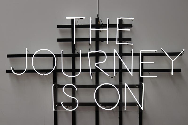 The sign with 'The journey is on' text on it