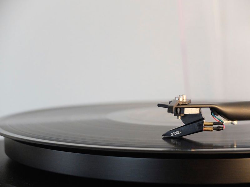 Close up shot of a record on a turntable with the needle resting on the record. 